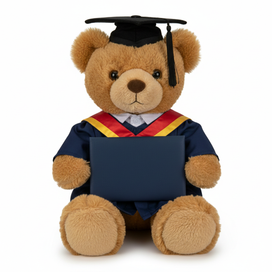 Graduation-themed teddy bear with a cap, gown, and scroll on a white background