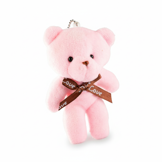 Pink teddy bear keychain with a 'love' ribbon on a white background
