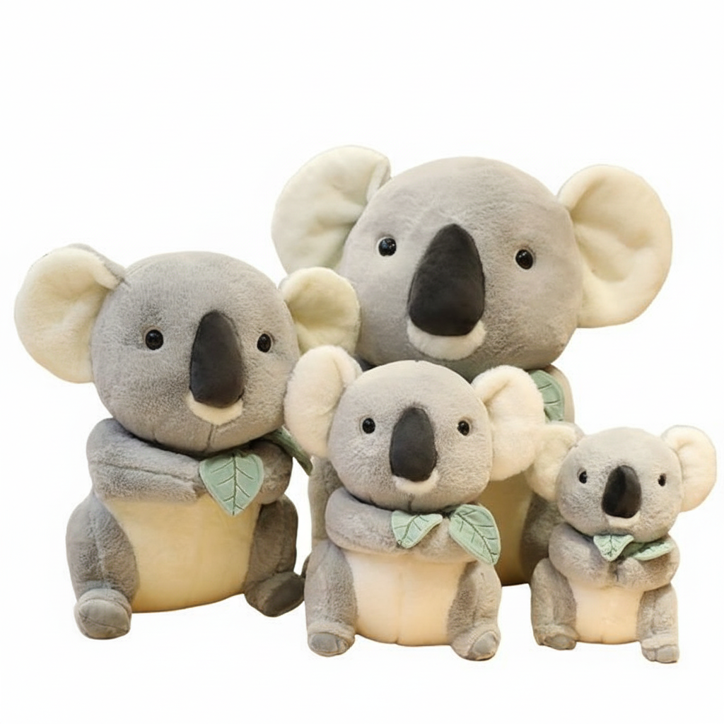 Set of four plush koala toys of different sizes on a white background